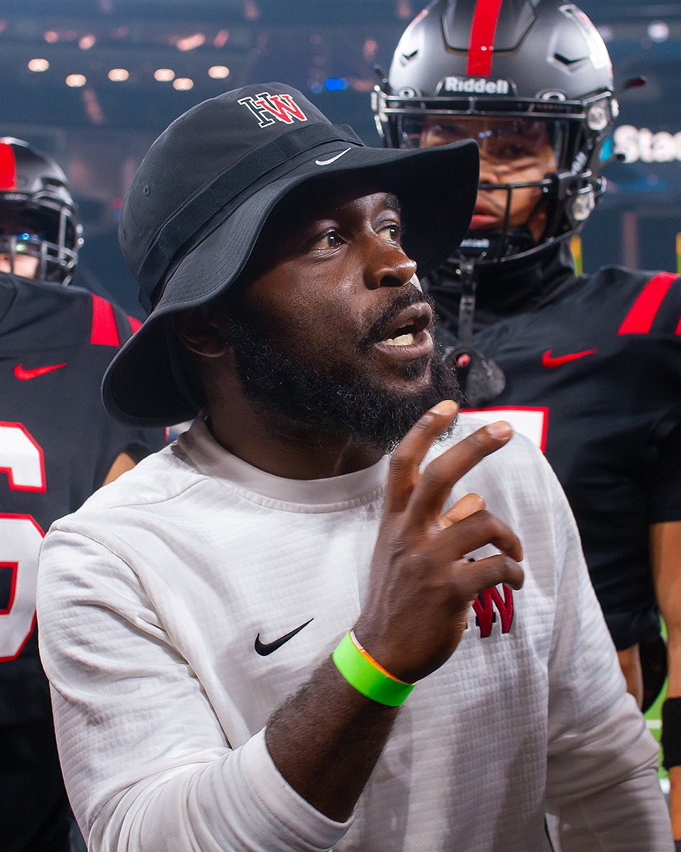 Junior Amazan coaching on the sideline at Harvard-Westlake School